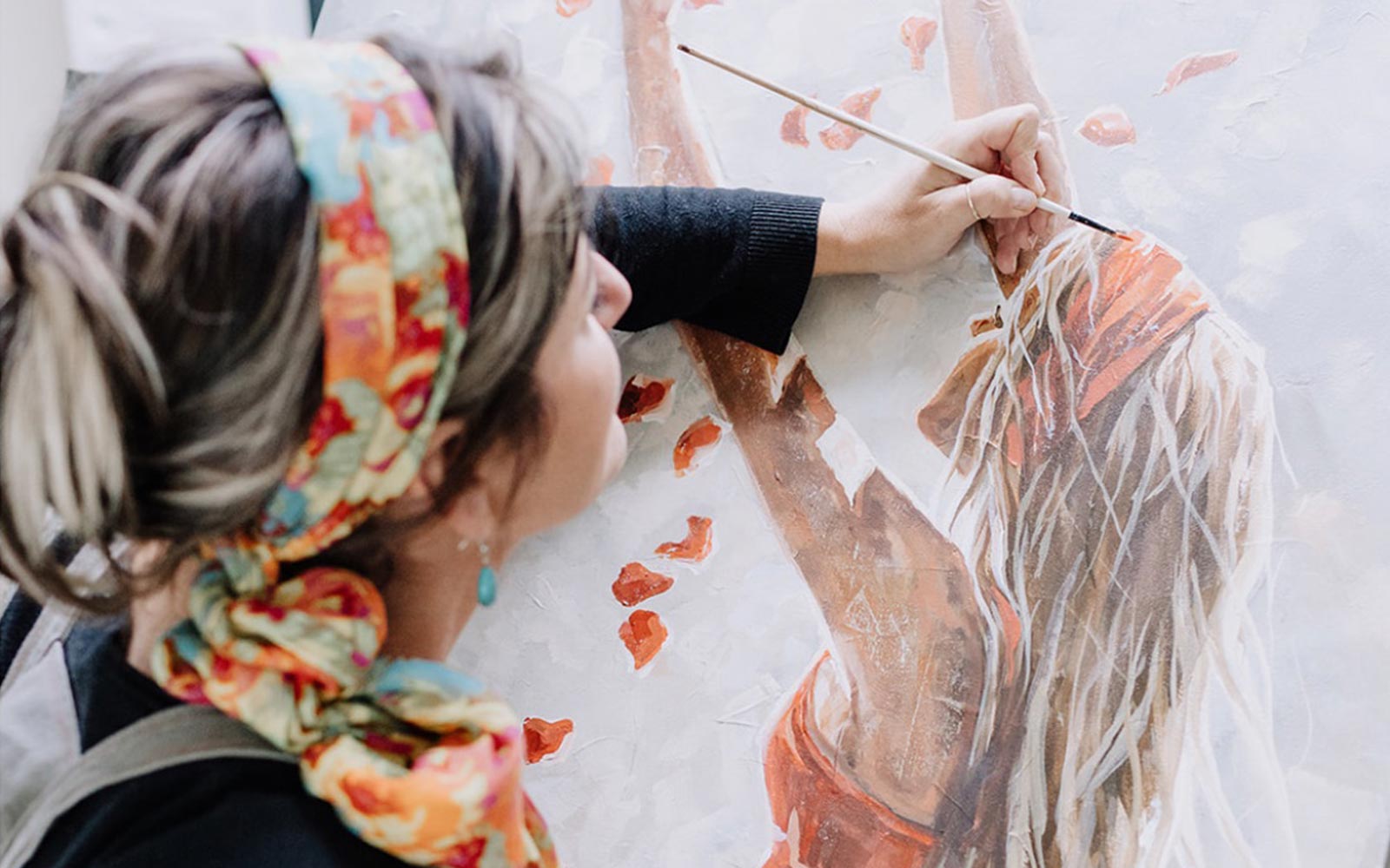 Maria painting in her studio